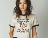 "Whatever Life Throws At You Duck" design on a natural ringer t-shirt with black contrast trim