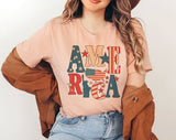 "Statue Of Liberty America" design on a peach unisex t-shirt