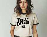"Treat Dealer Dog" design on a natural ringer t-shirt with black contrast trim
