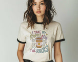 "I Take My Coffee On The Rocks" design on a natural ringer t-shirt with black contrast trim
