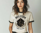 "Onyx Storm Fourth Wing" design on a natural ringer t-shirt with black contrast trim