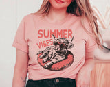"Summer Vibes Highland Cow" design on a peach unisex t-shirt
