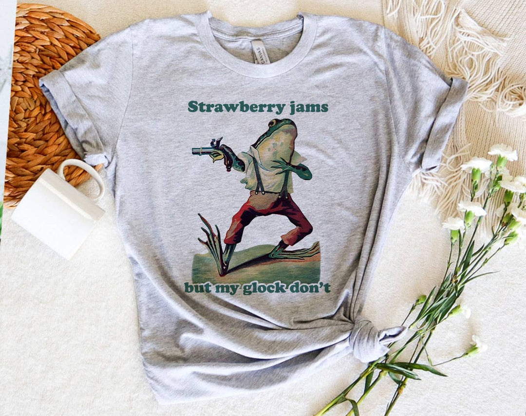 "Strawberry Jams, Glock Don't Frog Meme" design on a heather gray unisex t-shirt