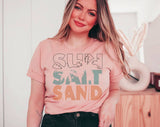 "Sun Salt Sand" design on a peach unisex t-shirt