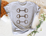 "Brushstroke Horse Bit Cowgirl" design on a heather gray unisex t-shirt