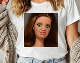 "Disgusted Doll Face Meme" design on a white unisex t-shirt