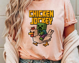 "Chicken Jockey" design on a peach unisex t-shirt