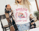 "Bookish Lovers Social Club Coquette" design on a white unisex t-shirt