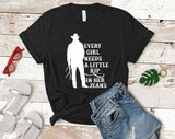 "Every Girl Needs A Little Rip In Her Jeans" design on a black unisex t-shirt