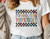 "It's Okay To Be Different Autism Awareness" design on a white unisex t-shirt