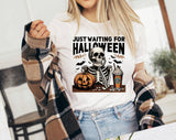 "Just Waiting For Halloween Skeleton" design on a white unisex t-shirt