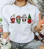 "Christmas Vacation Coffee Cups" design on an ash gray unisex crewneck sweatshirt