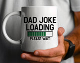 "Dad Joke Loading" design on a white ceramic coffee mug