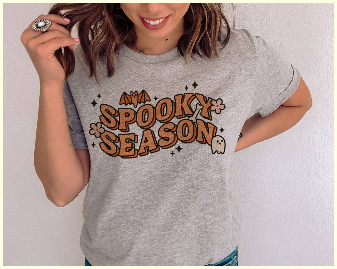 "Spooky Season Ghost" design on a heather gray unisex t-shirt