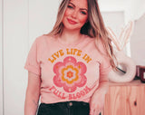 "Live Life In Full Bloom" design on a peach unisex t-shirt