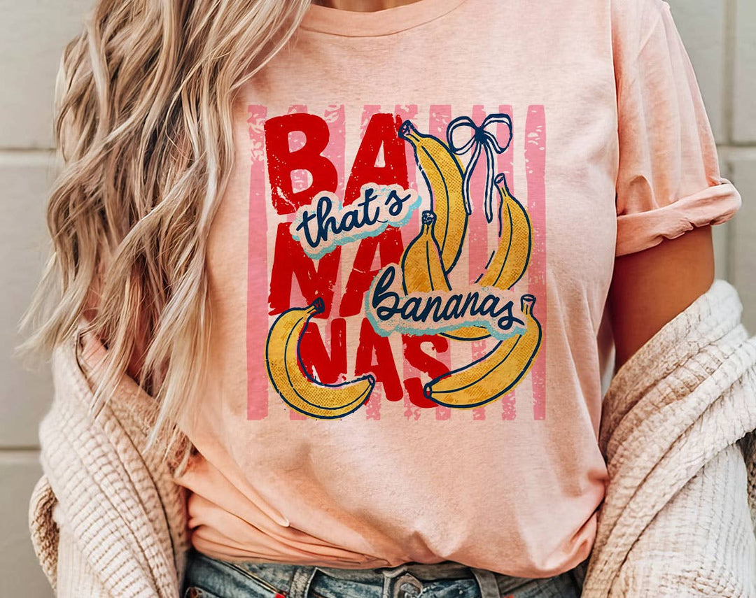 "That's Bananas Striped" design on a peach unisex t-shirt