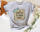 "Every Day Is A Fresh Start" design on a heather gray unisex t-shirt