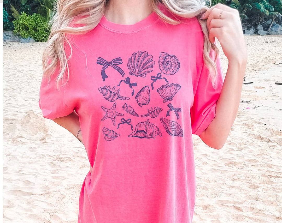 "Seashell Blue Beach Collage" design on a pink watermelon Comfort Colors t-shirt