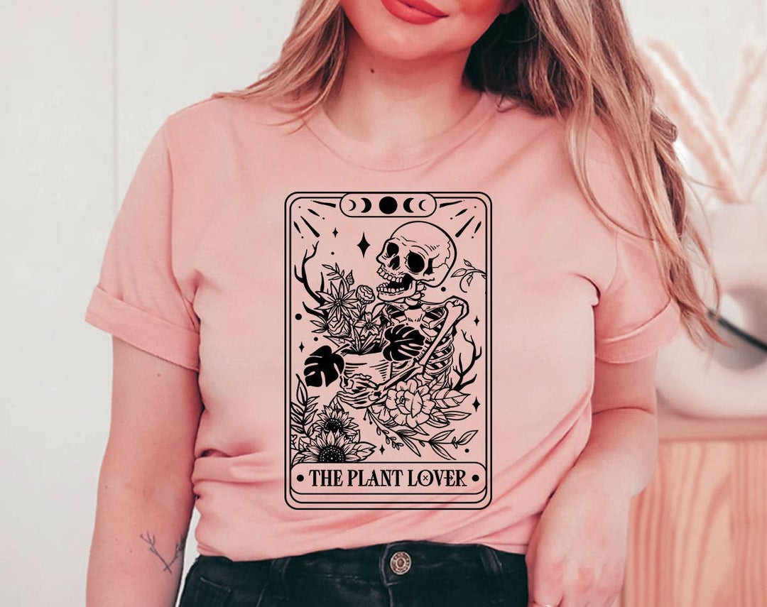 "The Plant Lover Tarot Black & White" design on a peach unisex t-shirt
