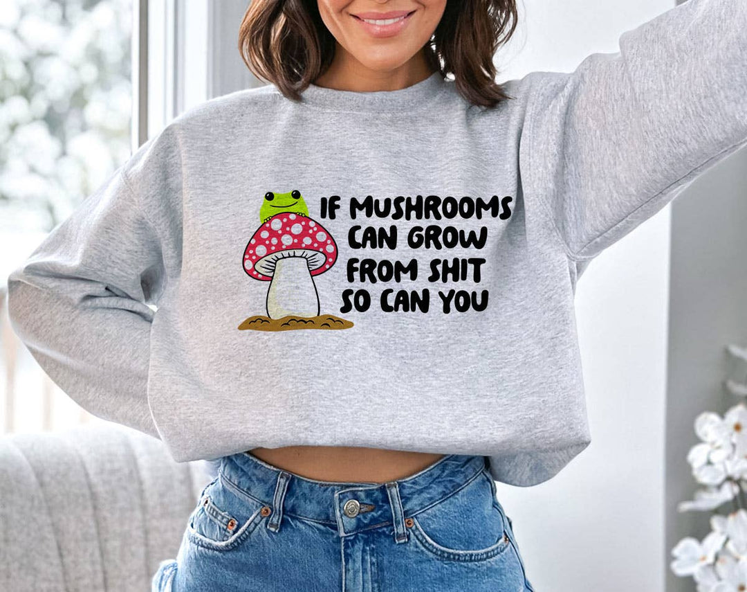 "If Mushrooms Can Grow From S$@t" design on an ash gray unisex crewneck sweatshirt
