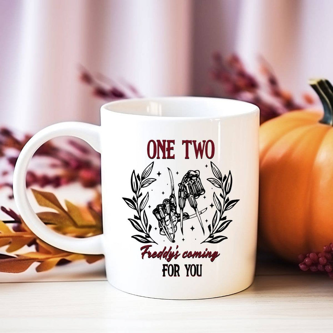 "One Two Freddy's Coming For You" Halloween design on a white coffee mug