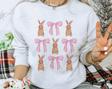 "Coquette Bunny" design on an ash gray unisex crewneck sweatshirt