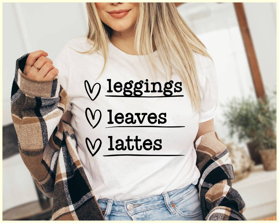 "Leggings Leaves Lattes" design on a white unisex t-shirt