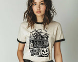 "Haunted House We Dare You" design on a natural ringer t-shirt with black contrast trim