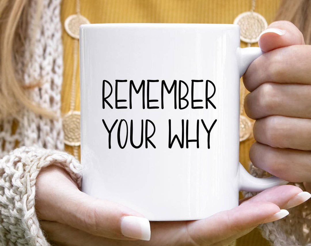 "Remember Your Why" design on a white ceramic coffee mug