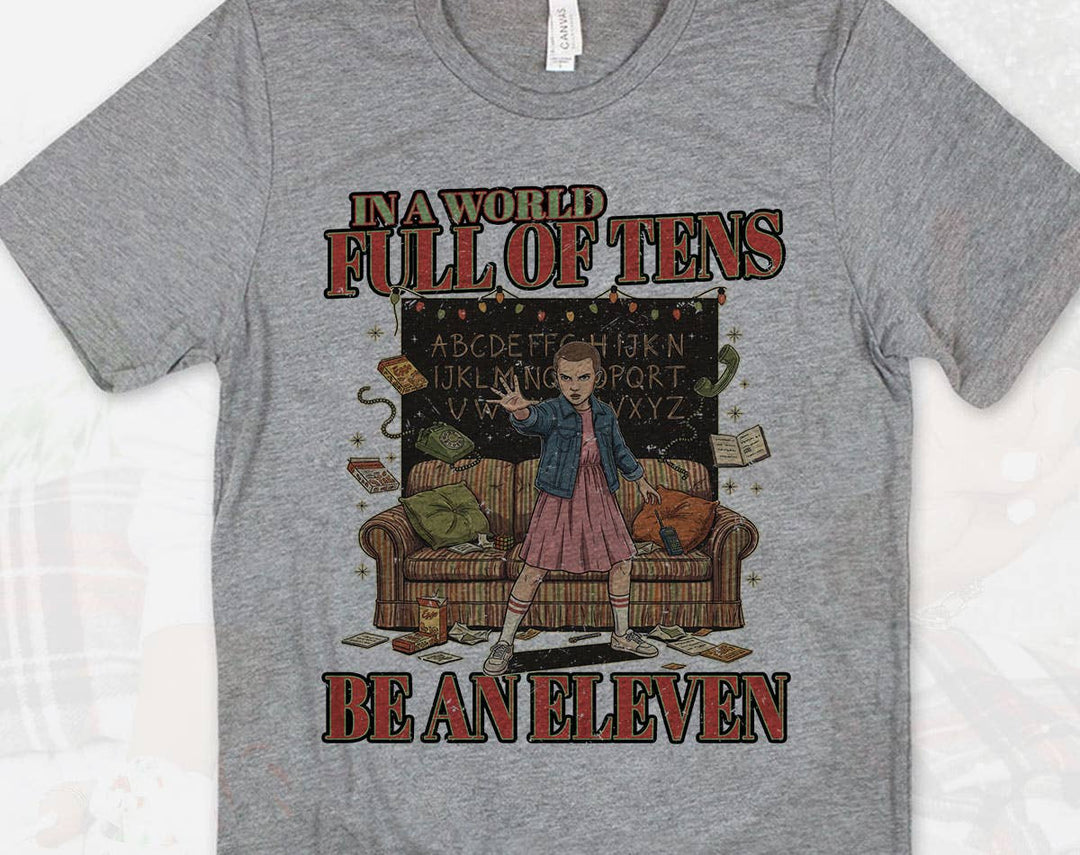 "Stranger Things In A World Full Of Tens" design on a heather gray unisex t-shirt