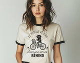 "Be Humble Be Kind Frog Bicycle" design on a natural ringer t-shirt with black contrast trim