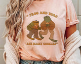 "Frog & Toad Ate Cookies" design on a peach unisex t-shirt