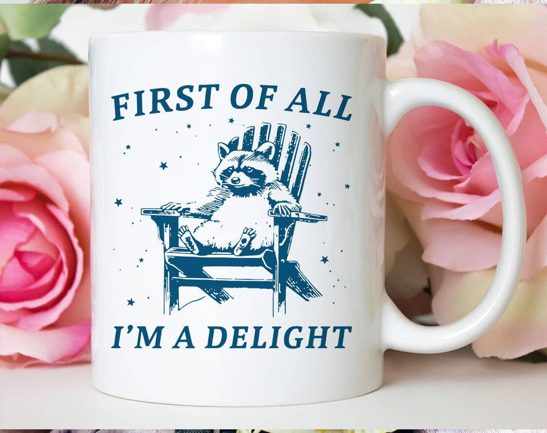 "First Of All, I'm A Delight" design on a white ceramic coffee mug