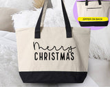 "Merry Christmas Cursive" design on a natural canvas zippered tote bag