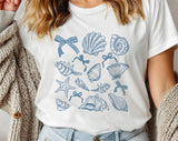 "Seashell Blue Beach Collage" design on a white unisex t-shirt