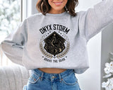 "Onyx Storm" design on an ash gray unisex crewneck sweatshirt