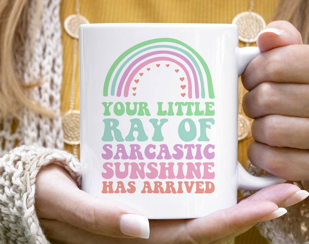 "Your Little Ray Of Sarcastic Sunshine" design on a white ceramic coffee mug
