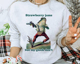 "Strawberry Jams, Glock Don't" design on an ash gray unisex crewneck sweatshirt