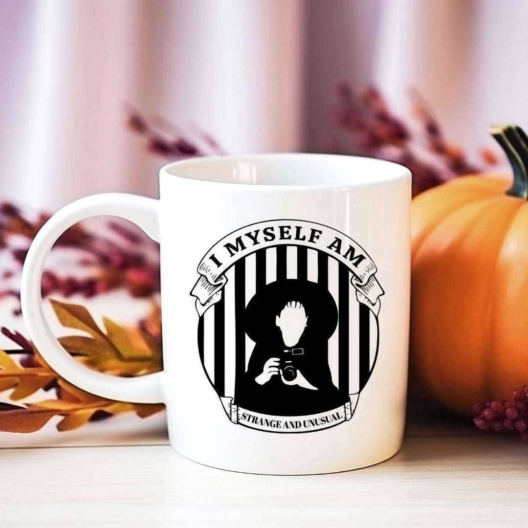 "I Myself am Strange and Unusual" Halloween design on a white coffee mug