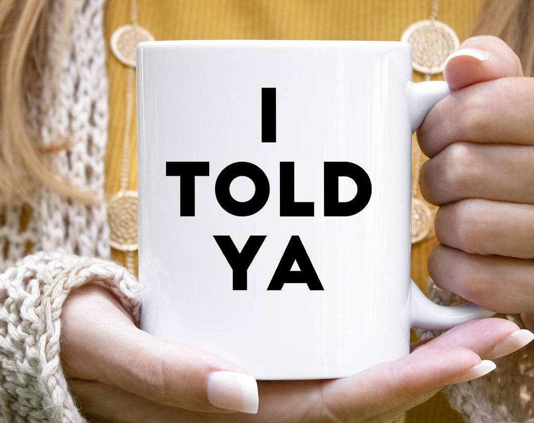 "I Told You" design on a white ceramic coffee mug