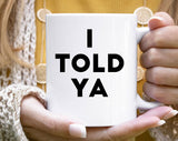 "I Told You" design on a white ceramic coffee mug