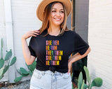 "She Her He Him Pronouns" design on a black unisex t-shirt
