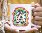 "The Older I Get The Heller The No" design on a white ceramic coffee mug