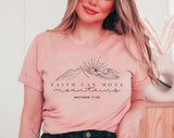 "Faith Can Move Mountains" design on a peach unisex t-shirt