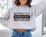 "Booktrovert" design, alternate view, on an ash gray unisex crewneck sweatshirt