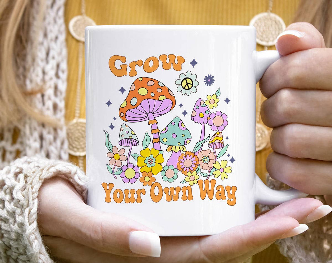 "Grow Your Own Way" design on a white ceramic coffee mug