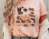 "Love The Unloved Weird Animals" design on a peach unisex t-shirt