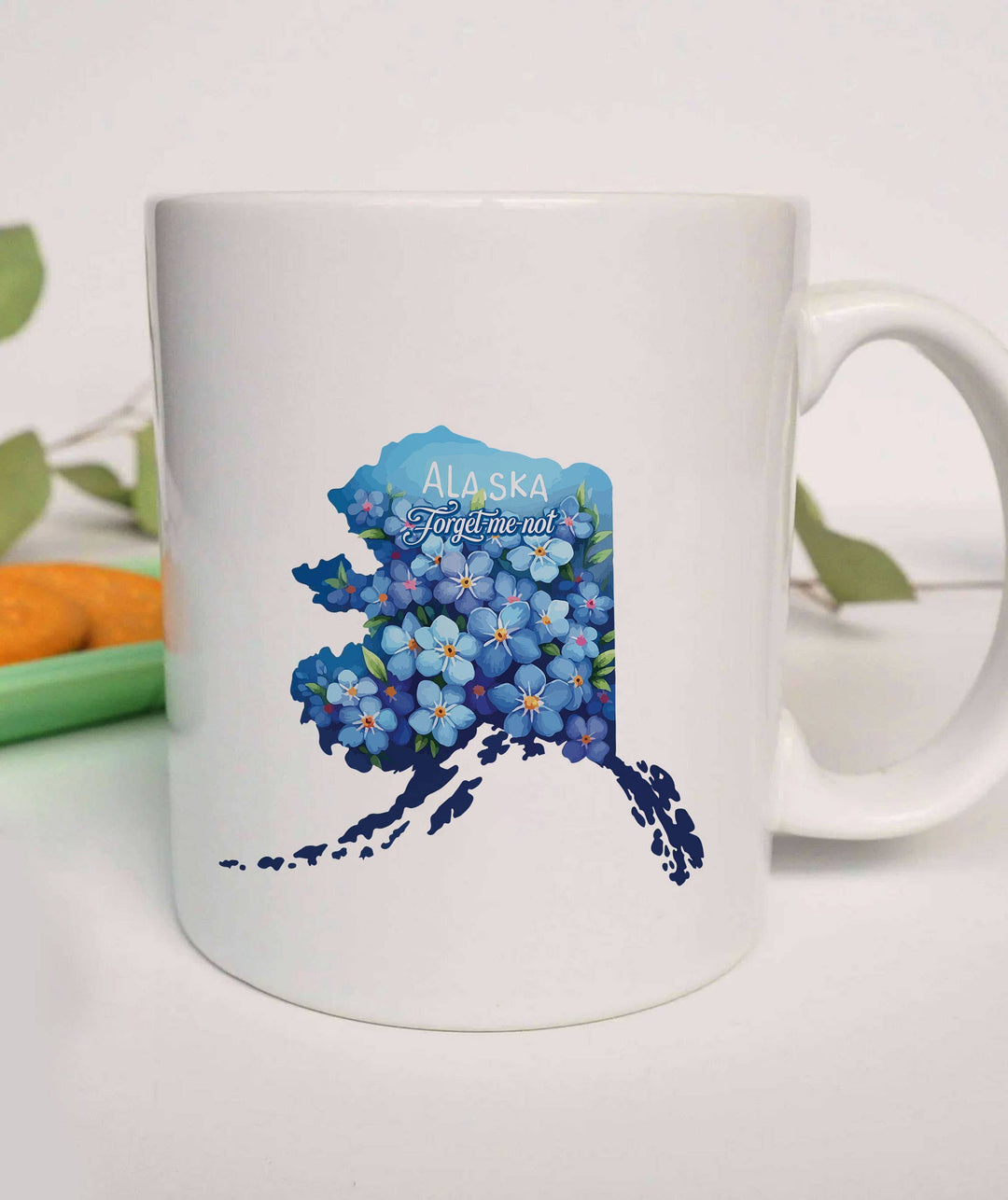 "Alaska State Flower Forget Me Not" design on a white ceramic coffee mug