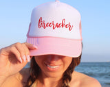 "Firecracker" design on a mesh-back snapback trucker hat