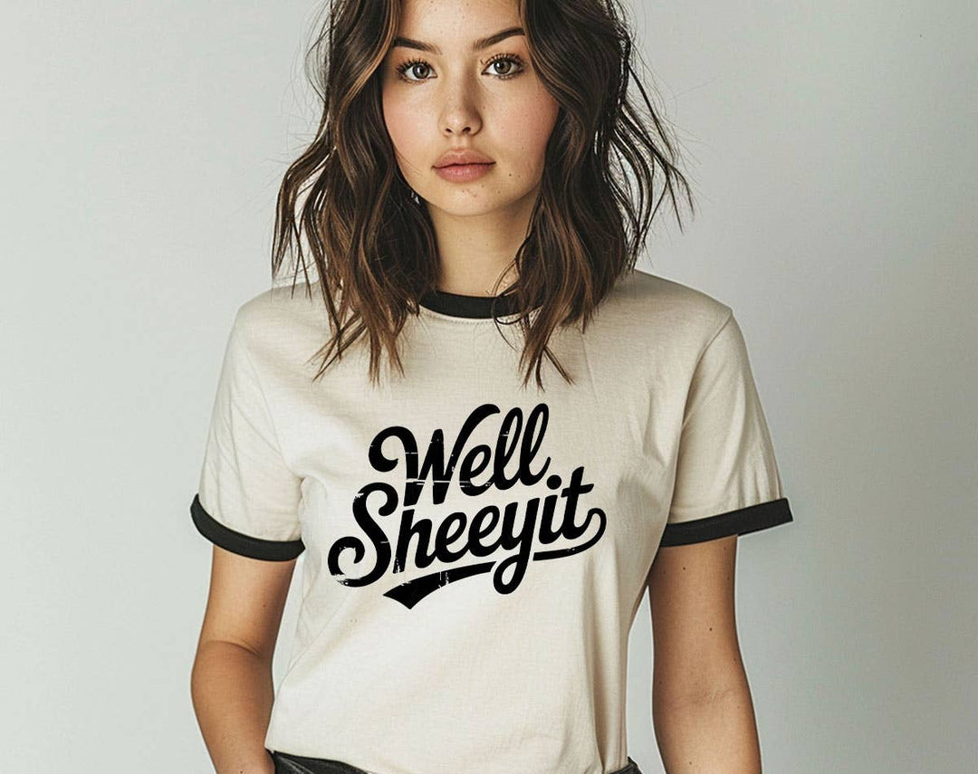 "Well Sheeyit" design on a natural ringer t-shirt with black contrast trim
